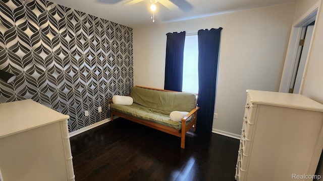 870 Lothrop Rd Unit 6/1, Detroit, MI 48202 - sitting room featuring dark wood-type flooring, ceiling fan, and an accent wall