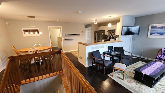 870 Lothrop Rd Unit 6/1, Detroit, MI 48202 - living room with baseboards and dark wood-style flooring