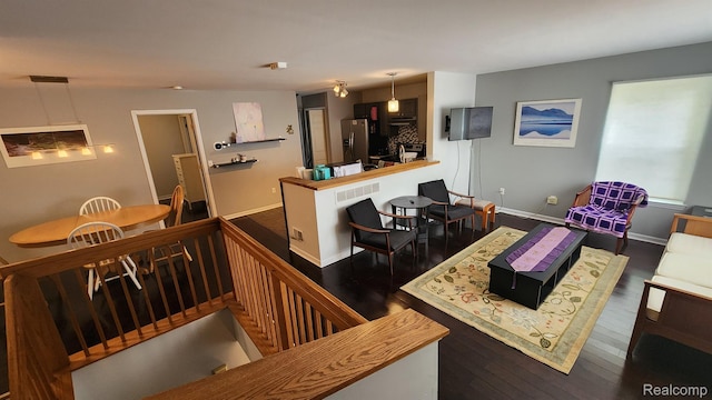 870 Lothrop Rd Unit 6/1, Detroit, MI 48202 - kitchen featuring hardwood / wood-style floors, stainless steel fridge, and hanging light fixtures