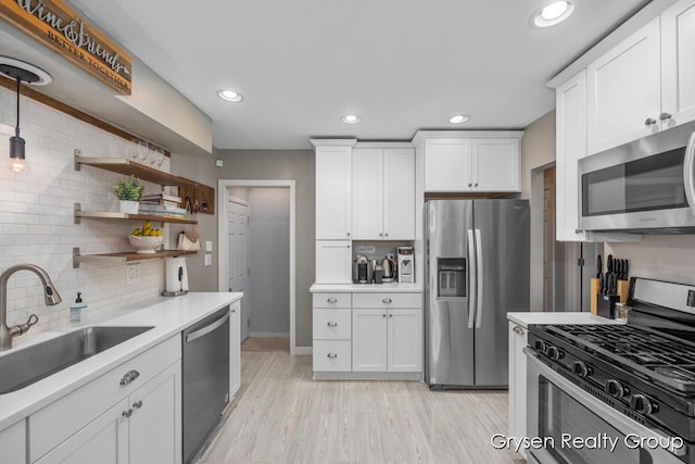 431 Homecrest Ave, Kalamazoo, MI 49001 - kitchen with appliances with stainless steel finishes, tasteful backsplash, white cabinetry, light countertops, and recessed lighting