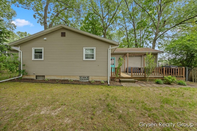431 Homecrest Ave, Kalamazoo, MI 49001 - rear view of house with a wooden deck and a yard