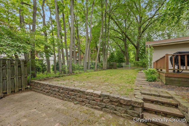 431 Homecrest Ave, Kalamazoo, MI 49001 - fenced backyard featuring a patio area and a deck