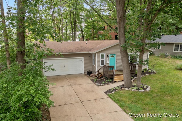 431 Homecrest Ave, Kalamazoo, MI 49001 - view of front facade featuring a front yard, concrete driveway, a wooden deck, and an attached garage