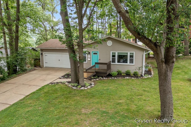 431 Homecrest Ave, Kalamazoo, MI 49001 - view of front facade with concrete driveway, a front yard, and an attached garage