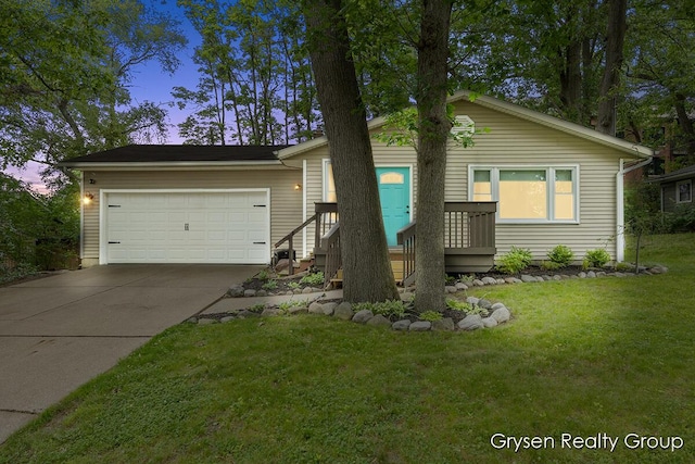 431 Homecrest Ave, Kalamazoo, MI 49001 - ranch-style house with driveway, an attached garage, and a yard