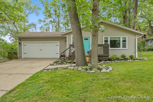 431 Homecrest Ave, Kalamazoo, MI 49001 - view of front of home with a garage, concrete driveway, and a front yard