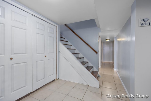 431 Homecrest Ave, Kalamazoo, MI 49001 - stairs featuring tile patterned floors and baseboards