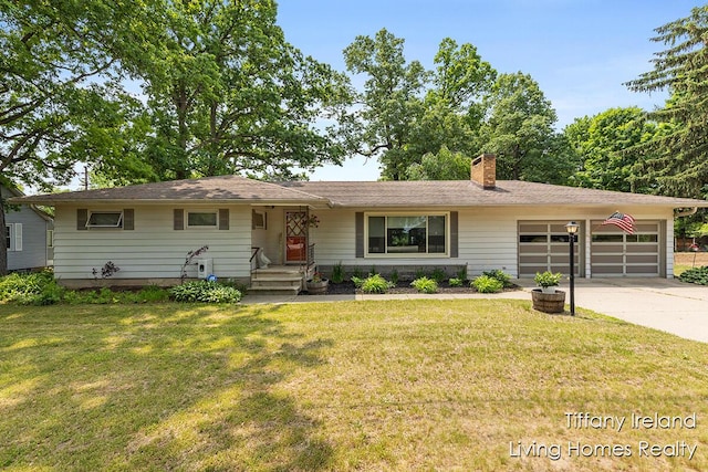 11737 W Carson City Rd, Greenville, MI 48838 - ranch-style house with an attached garage, concrete driveway, a chimney, and a front lawn