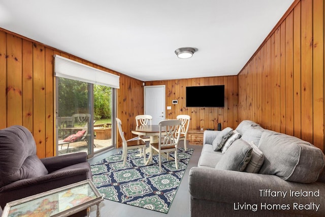 11737 W Carson City Rd, Greenville, MI 48838 - living area featuring wood walls and wood finished floors