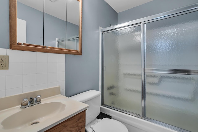 11786 E Sauk Trl, Jerome, MI 49249 - bathroom featuring combined bath / shower with glass door, vanity, and tasteful backsplash