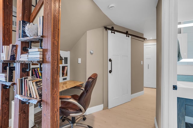 11786 E Sauk Trl, Jerome, MI 49249 - office with light wood finished floors, lofted ceiling, and a barn door