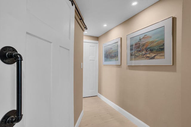 11786 E Sauk Trl, Jerome, MI 49249 - corridor with light wood-type flooring, recessed lighting, and a barn door