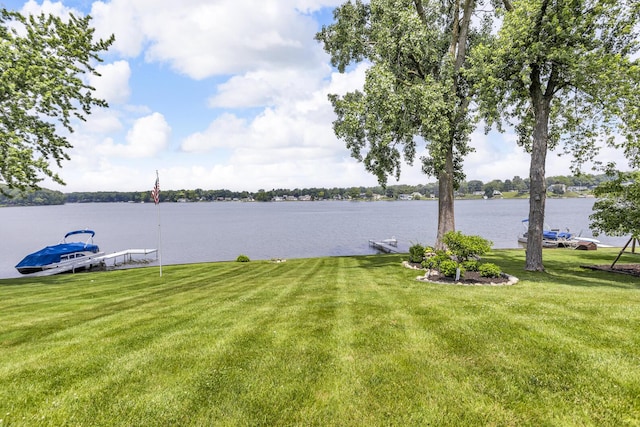 11786 E Sauk Trl, Jerome, MI 49249 - view of grassy yard with a water view and a dock