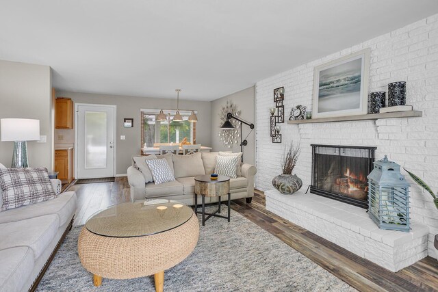 11786 E Sauk Trl, Jerome, MI 49249 - living area featuring wood finished floors and a fireplace