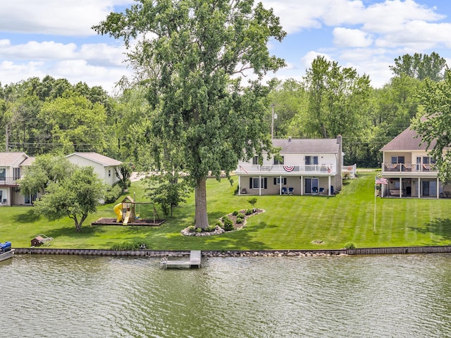 11786 E Sauk Trl, Jerome, MI 49249 - rear view of house featuring a water view and a lawn