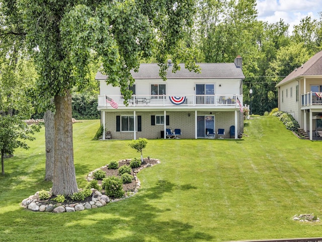 11786 E Sauk Trl, Jerome, MI 49249 - rear view of property featuring a lawn, brick siding, a deck, and a chimney