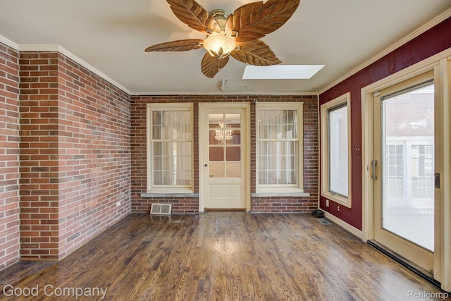 20 Oxford Blvd, Pleasant Ridge, MI 48069 - unfurnished sunroom with brick wall, a skylight, wood finished floors, crown molding, and a chandelier
