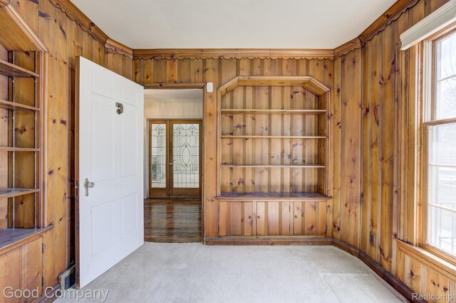 20 Oxford Blvd, Pleasant Ridge, MI 48069 - empty room with wooden walls, healthy amount of natural light, and built in features