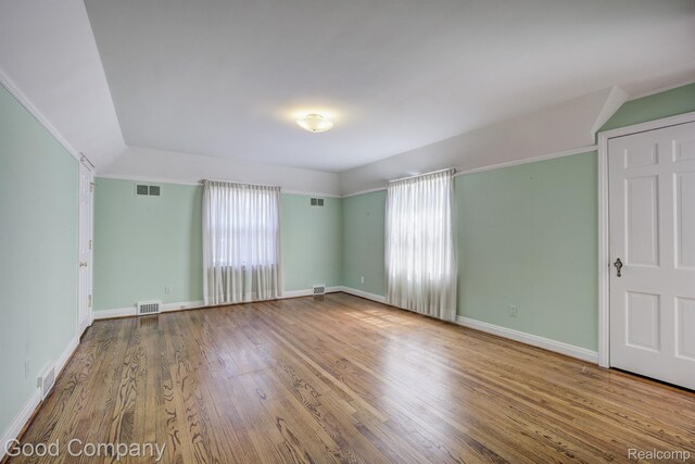 20 Oxford Blvd, Pleasant Ridge, MI 48069 - spare room featuring wood finished floors and vaulted ceiling