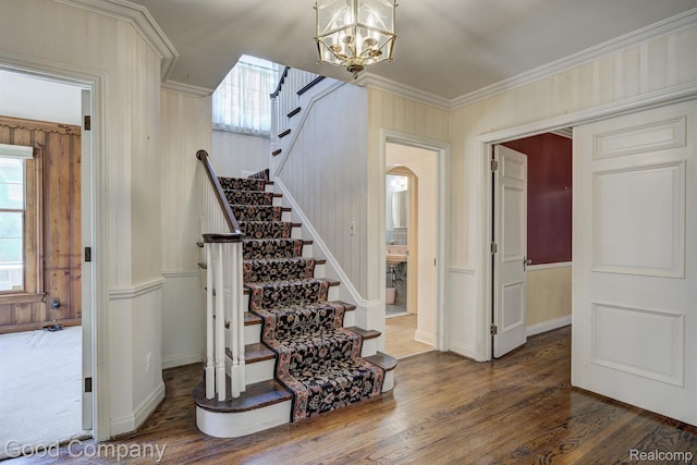 20 Oxford Blvd, Pleasant Ridge, MI 48069 - stairs featuring healthy amount of natural light, crown molding, wood finished floors, a chandelier, and arched walkways