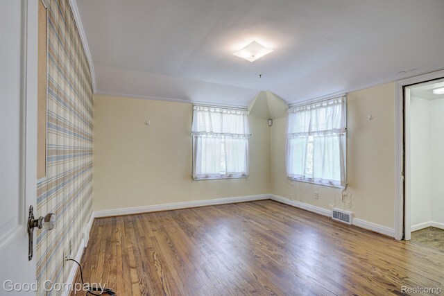 20 Oxford Blvd, Pleasant Ridge, MI 48069 - empty room with wood finished floors and vaulted ceiling