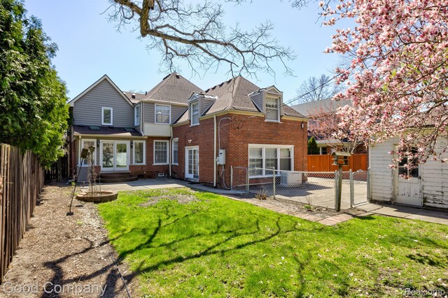 20 Oxford Blvd, Pleasant Ridge, MI 48069 - back of house with brick siding, a fenced backyard, a patio, and roof with shingles