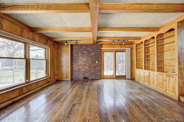 20 Oxford Blvd, Pleasant Ridge, MI 48069 - unfurnished living room with rail lighting, hardwood / wood-style floors, wooden walls, and beamed ceiling