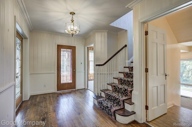 20 Oxford Blvd, Pleasant Ridge, MI 48069 - foyer entrance with wood finished floors, stairs, a chandelier, and ornamental molding