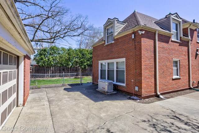 20 Oxford Blvd, Pleasant Ridge, MI 48069 - view of home's exterior featuring brick siding, a shingled roof, and a patio