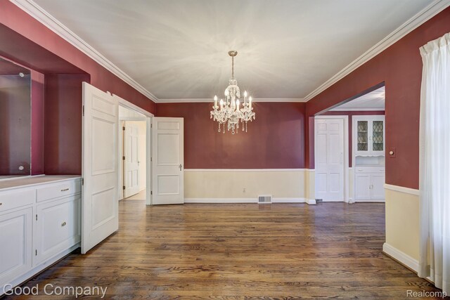 20 Oxford Blvd, Pleasant Ridge, MI 48069 - unfurnished dining area featuring dark wood finished floors, a chandelier, and crown molding