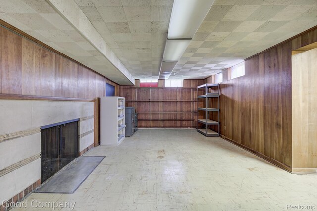 20 Oxford Blvd, Pleasant Ridge, MI 48069 - basement with wooden walls, a fireplace with flush hearth, and light floors