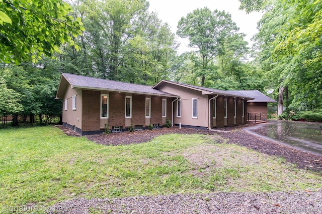 23415 Beech Rd, Southfield, MI 48033 - ranch-style home with a front lawn and brick siding