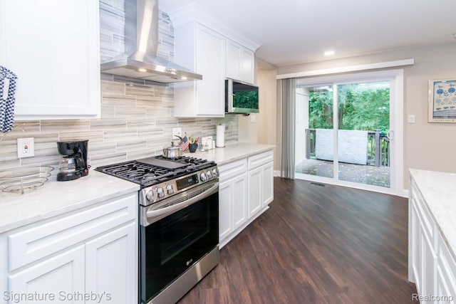 23415 Beech Rd, Southfield, MI 48033 - kitchen with stainless steel range with gas cooktop, wall chimney range hood, dark wood-style floors, and decorative backsplash