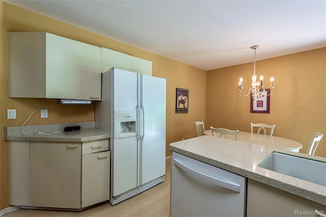 6760 Oyster Cv, West Bloomfield, MI 48323 - kitchen featuring white appliances, a chandelier, decorative light fixtures, and light wood finished floors