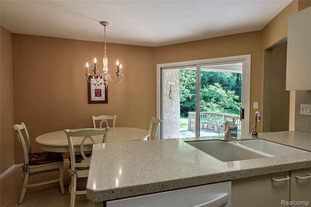 6760 Oyster Cv, West Bloomfield, MI 48323 - dining area featuring light wood finished floors and a chandelier