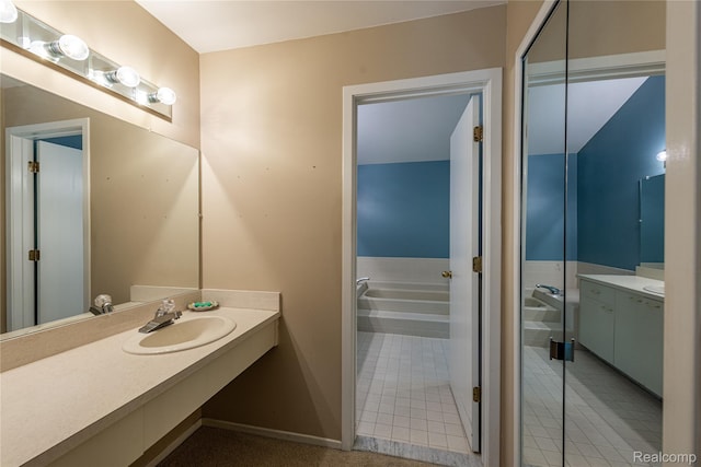 6760 Oyster Cv, West Bloomfield, MI 48323 - bathroom with vanity, a garden tub, and tile patterned flooring