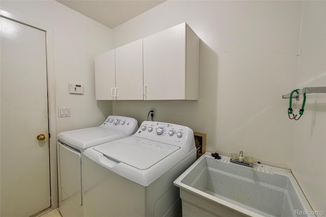 6760 Oyster Cv, West Bloomfield, MI 48323 - laundry room with washer and clothes dryer and cabinet space