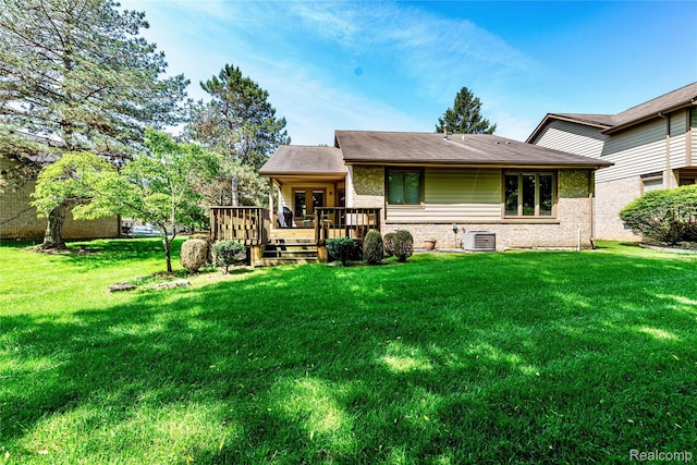 6760 Oyster Cv, West Bloomfield, MI 48323 - rear view of property with a wooden deck, a yard, and brick siding