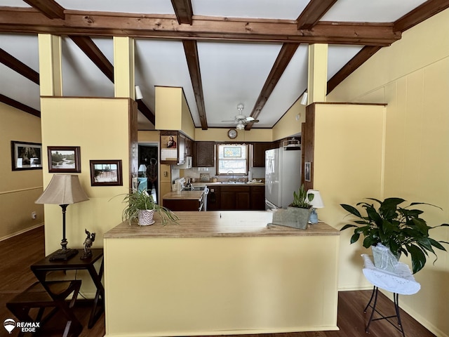 449 Noric Dr, Roscommon, MI 48653 - kitchen featuring freestanding refrigerator, dark wood finished floors, light countertops, electric range oven, and dark brown cabinetry