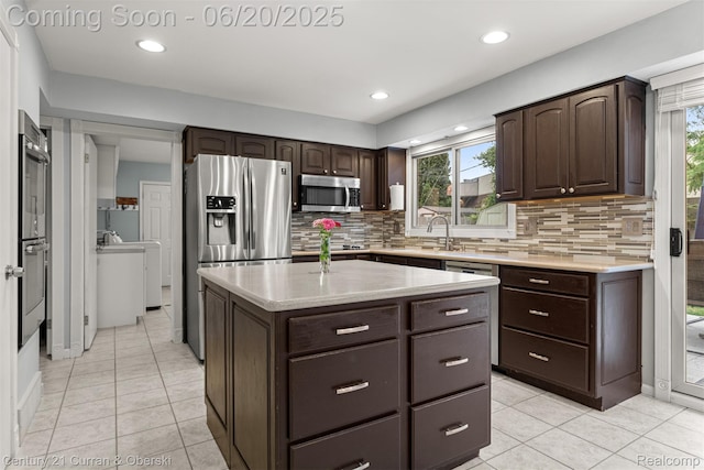 2138 Metzner Rd, Commerce Twp, MI 48390 - kitchen with appliances with stainless steel finishes, dark brown cabinetry, light tile patterned flooring, backsplash, and recessed lighting