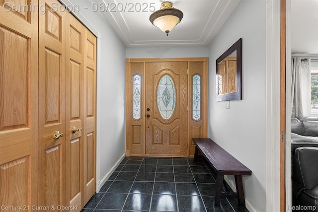 2138 Metzner Rd, Commerce Twp, MI 48390 - foyer with baseboards and dark tile patterned flooring