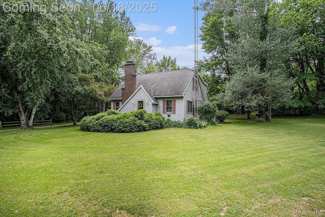 44988 52nd St, Lawrence, MI 49064 - view of front of property with a front lawn, a chimney, and roof with shingles