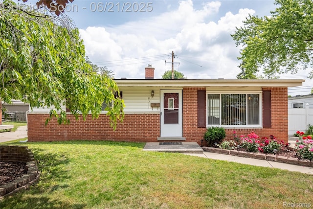 8311 Gulley St, Taylor, MI 48180 - ranch-style home with brick siding, a chimney, and a front yard