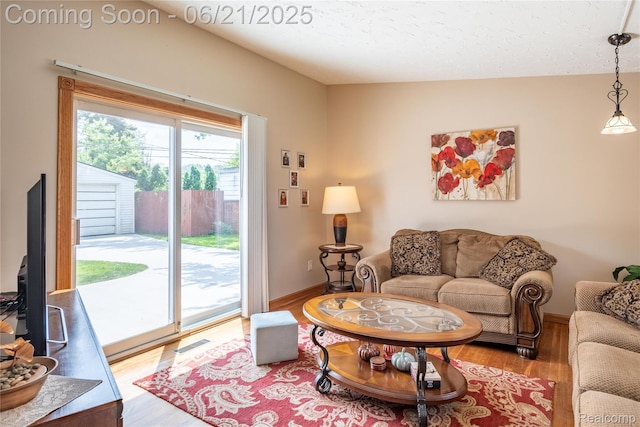 8311 Gulley St, Taylor, MI 48180 - living area featuring wood finished floors and baseboards
