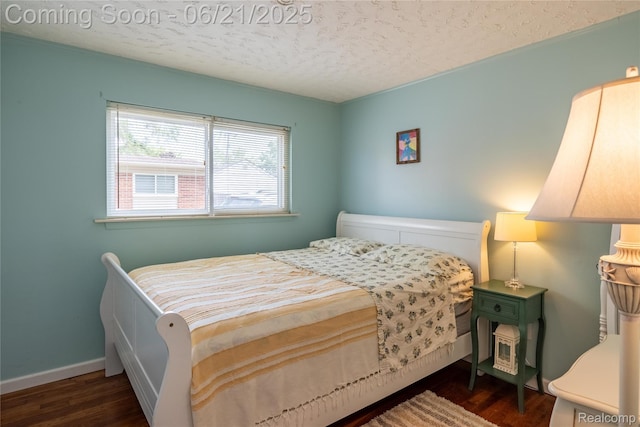 8311 Gulley St, Taylor, MI 48180 - bedroom featuring a textured ceiling and wood finished floors