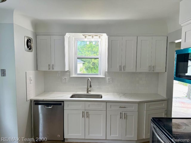 22902 Olmstead St, Dearborn, MI 48124 - kitchen with appliances with stainless steel finishes, backsplash, plenty of natural light, and light stone counters