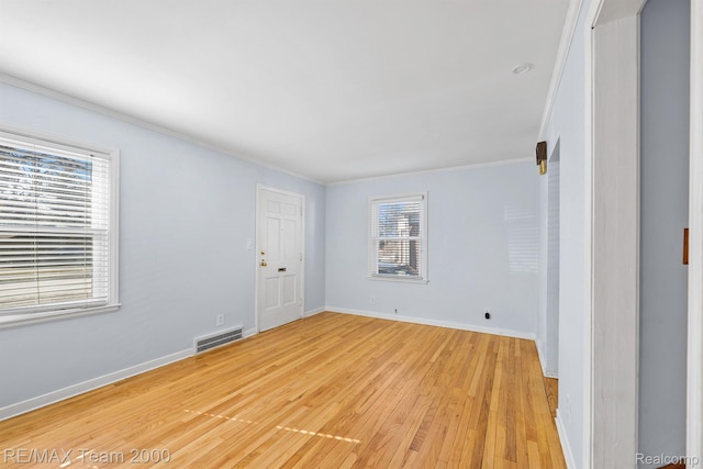22902 Olmstead St, Dearborn, MI 48124 - spare room featuring healthy amount of natural light, light wood-style flooring, and ornamental molding