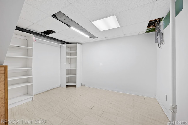 22902 Olmstead St, Dearborn, MI 48124 - finished below grade area with tile patterned floors and a paneled ceiling