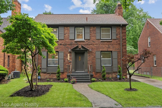 14638 Greenview Rd, Detroit, MI 48223 - view of front of house with a chimney, a shingled roof, and brick siding