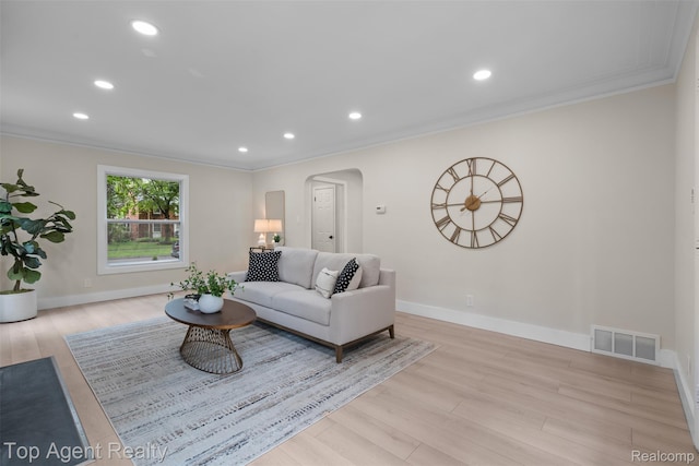 14638 Greenview Rd, Detroit, MI 48223 - living area featuring arched walkways, ornamental molding, wood finished floors, and recessed lighting